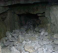 Collapsed interior of Cairn H