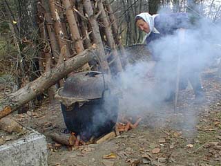Making pig food in a cauldron